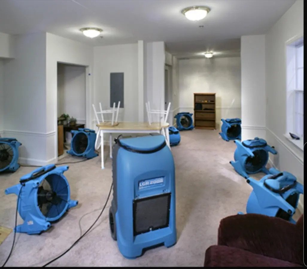 Air movers and dehumidifier setup for Water Damage Restoration in Gardiner